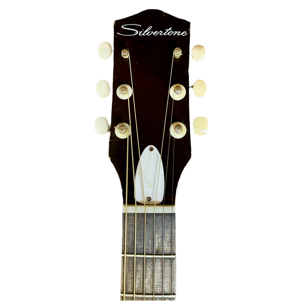 Guitar headstock with 'Silvertone' branding on a white background