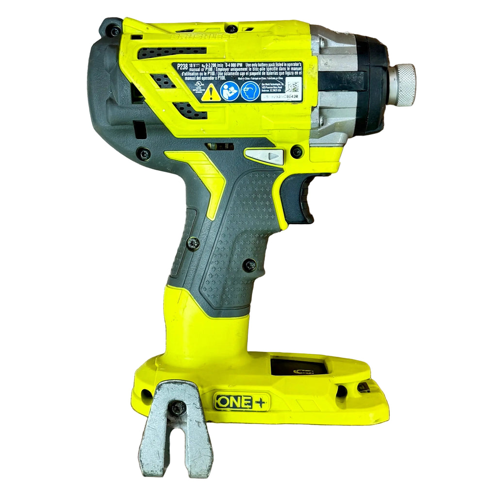 RYOBI ONE+ 18V 1/4" Brushless Cordless 3-Speed Hex Impact Driver (P238) Yellow and gray cordless drill on a wooden surface