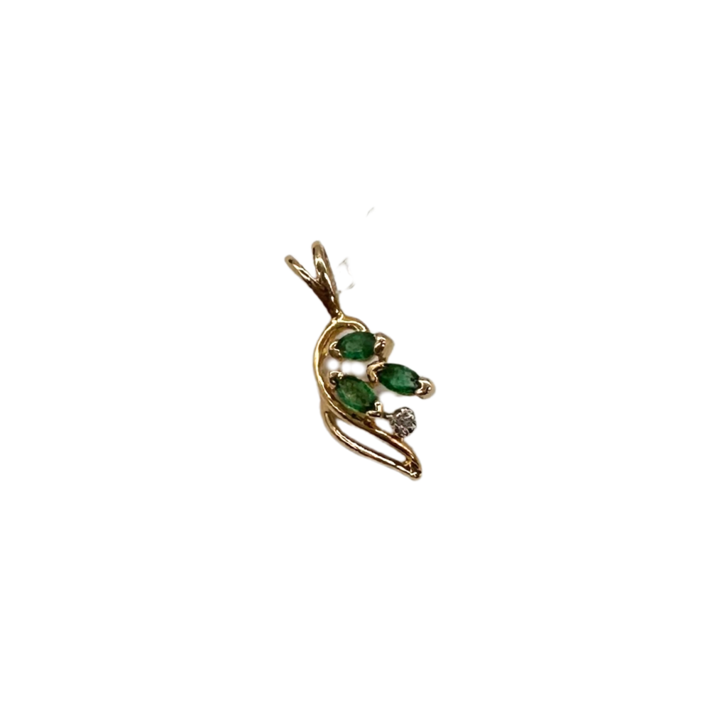 Gold pendant with green gemstones on a white background