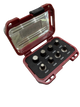 Red metal tool case with clear lid and multiple small metallic objects inside on a white background