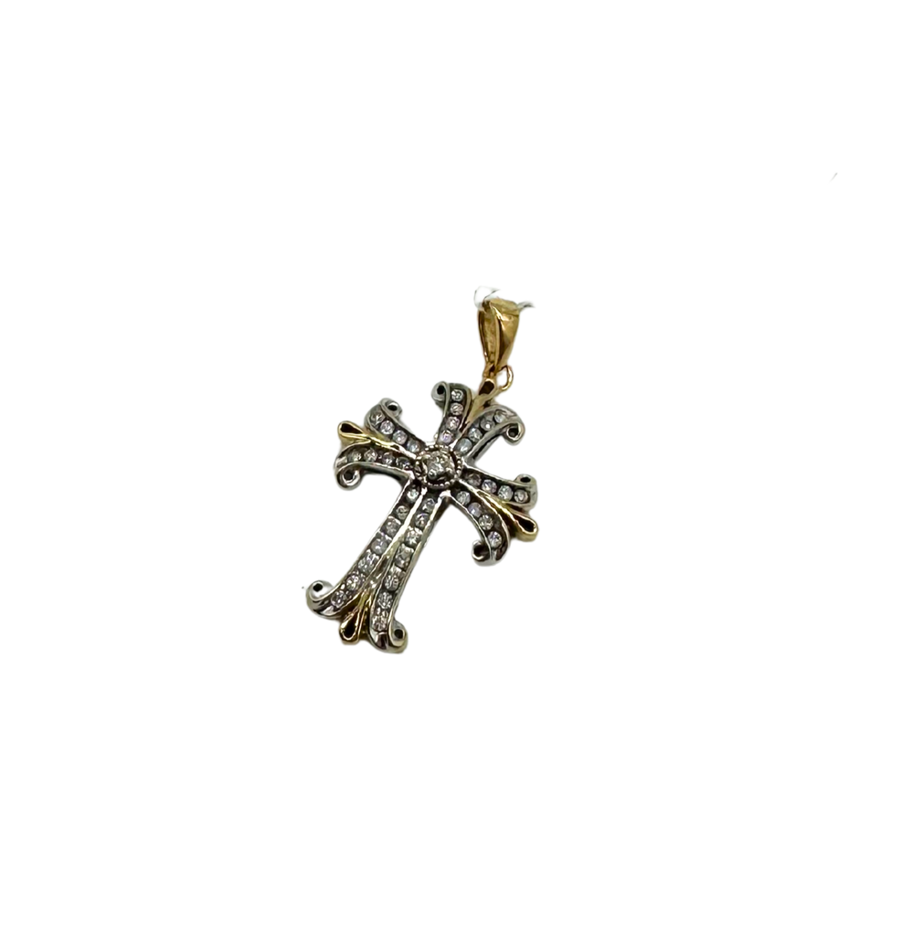 Gold and silver cross pendant with diamonds on a white background