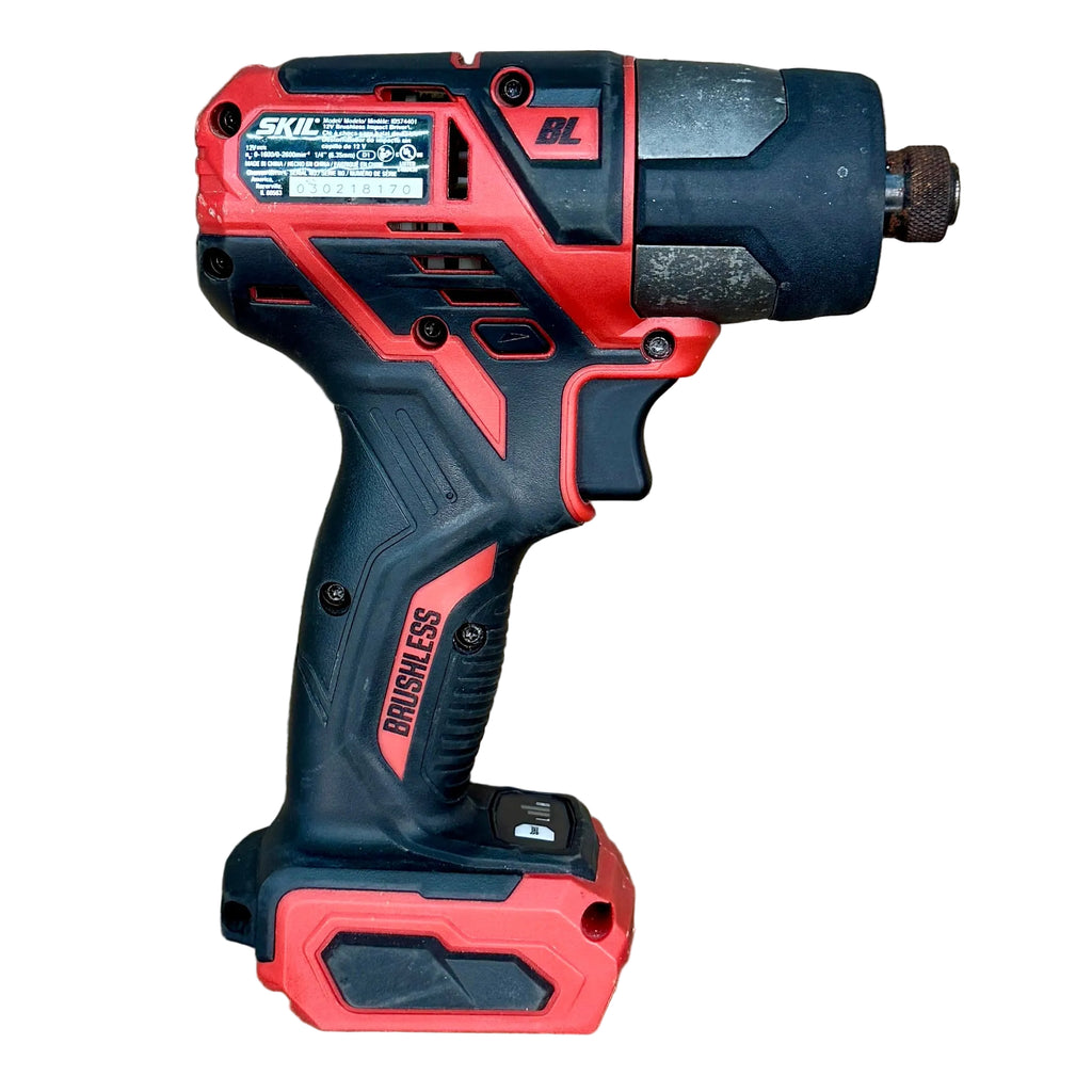 SKIL PWR CORE 12 12V 1/4" Brushless Cordless Hex Impact Driver w/ Battery & Charger (ID574401) Red and black power drill on a wooden surface