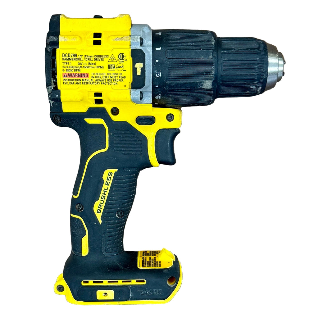 DeWalt ATOMIC 20V MAX 1/2" Brushless Cordless Hammer Drill/Driver (DCD799) Yellow and black cordless drill on a wooden surface
