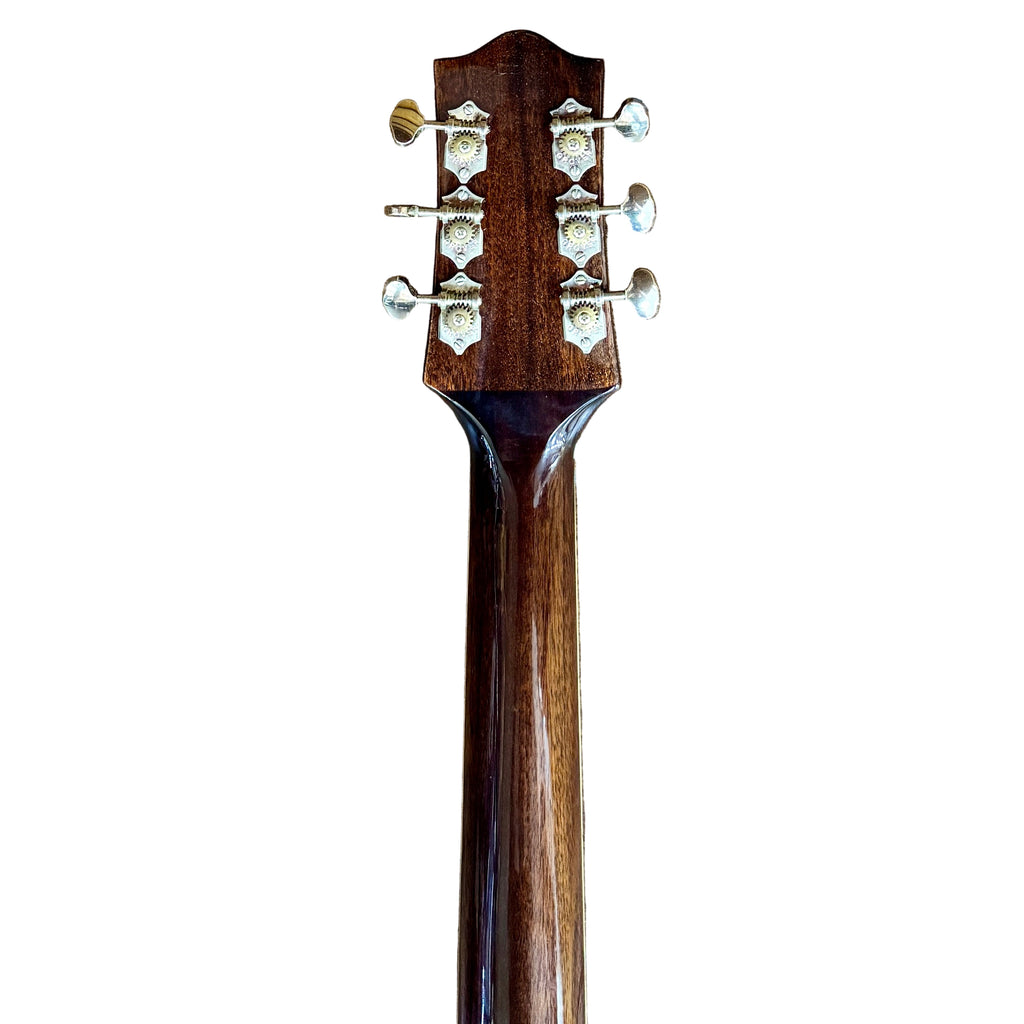 The Loar LH-280-CSN Hollow Body Electric Guitar headstock with tuning pegs on a wooden floor