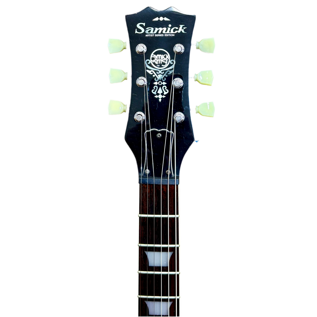 Samick Artist Series Edition Les Paul Style Left-Handed Electric Guitar headstock with Samick branding on a white background