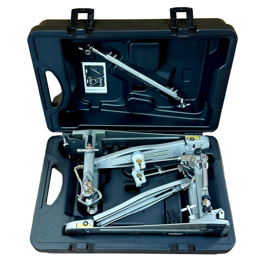 TAMA Speed Cobra 910 Twin Double Bass Drum Pedal w/ Hard Case Open black tool case with metal tools on a wooden floor.