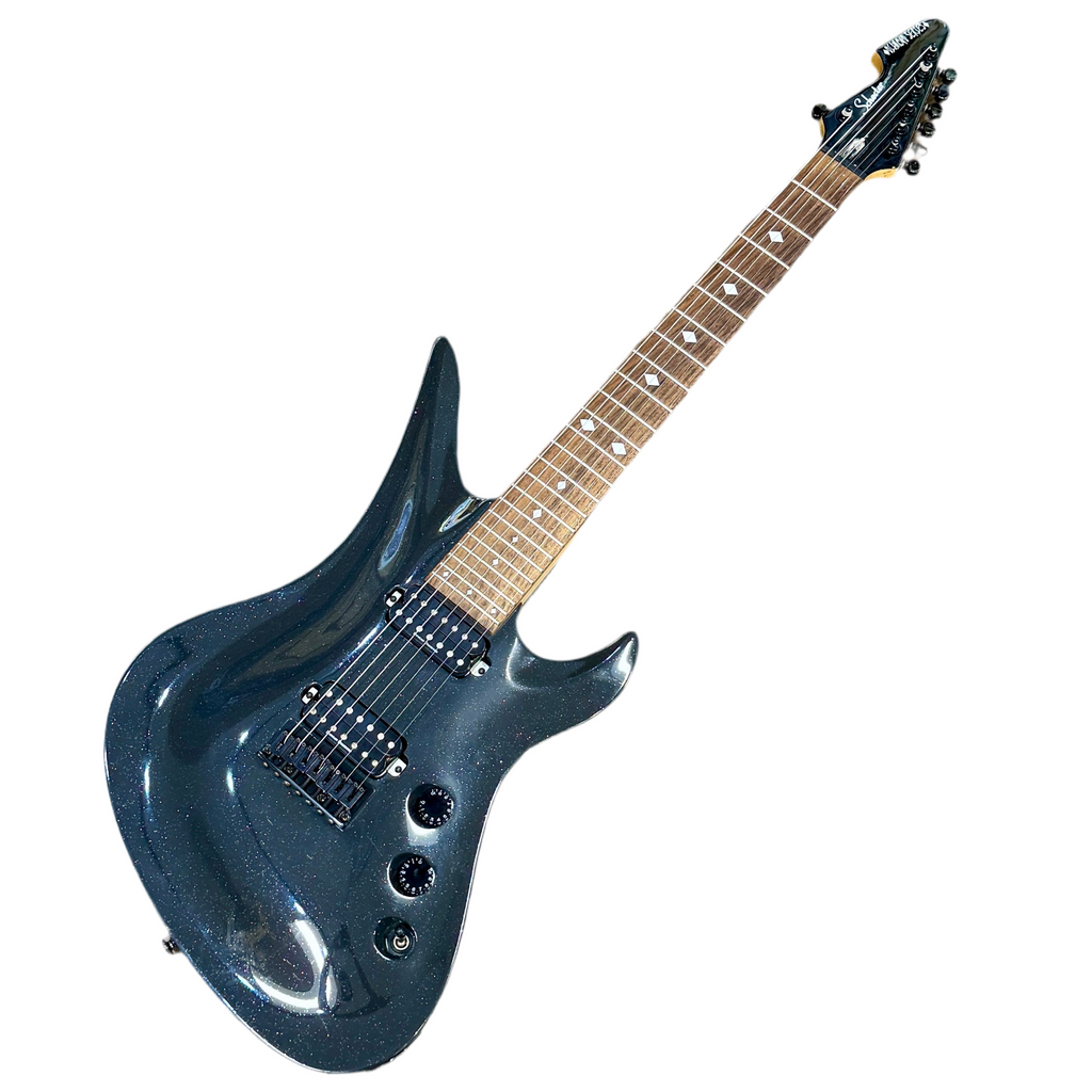 Black electric guitar with a white background