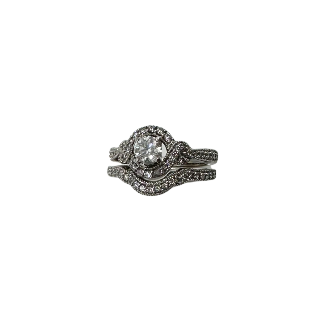 Diamond ring with a matching band on a white background