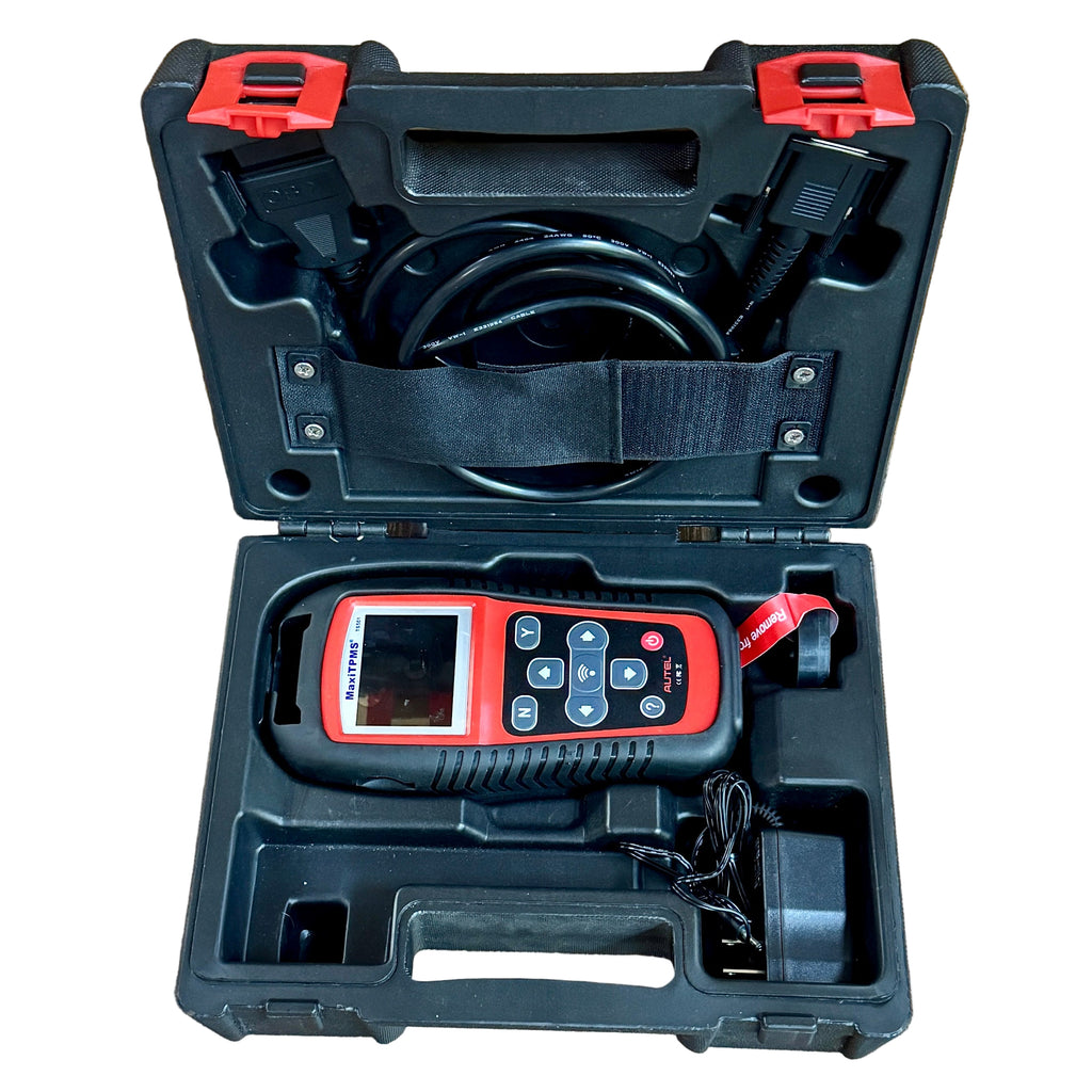 AUTEL MaxiTPMS TS501 Vehicle Diagnostic Code Scanner Tool w/ Hard Case Red diagnostic tool in a black case on a wooden floor