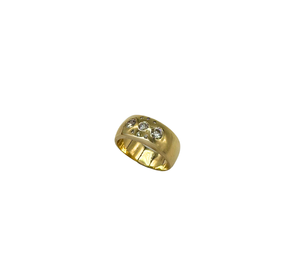 Gold ring with embedded diamonds on a white background