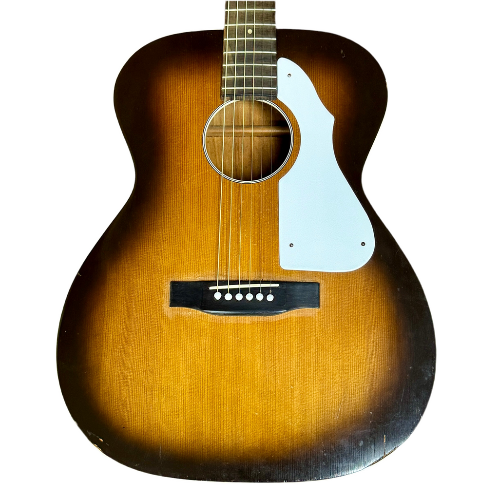 Acoustic guitar with a sunburst finish on a white background