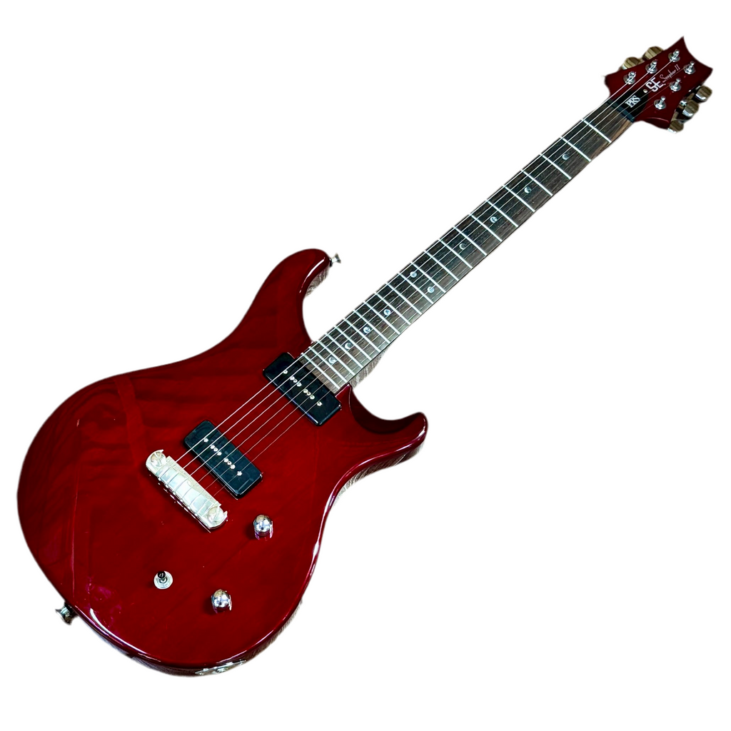 Red prs paul reed smith se soapbar ii electric guitar on a white background