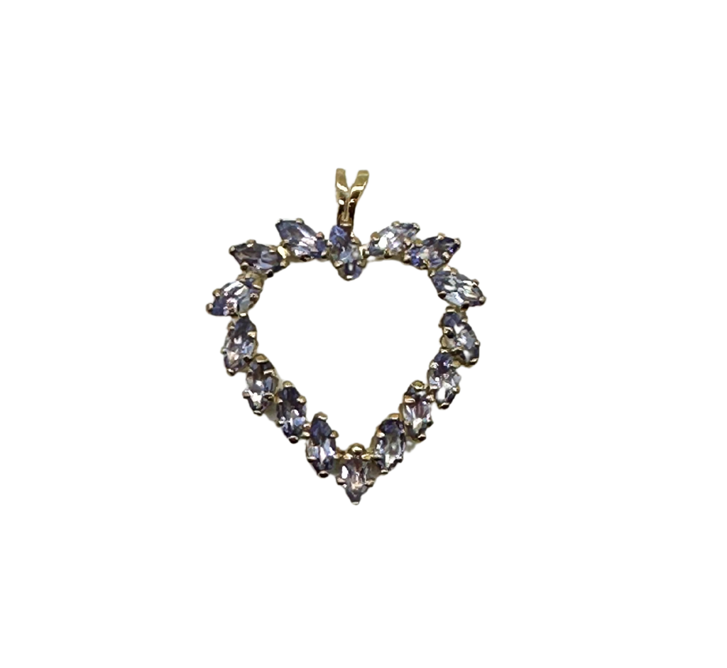 Heart-shaped diamond pendant on a clear background
