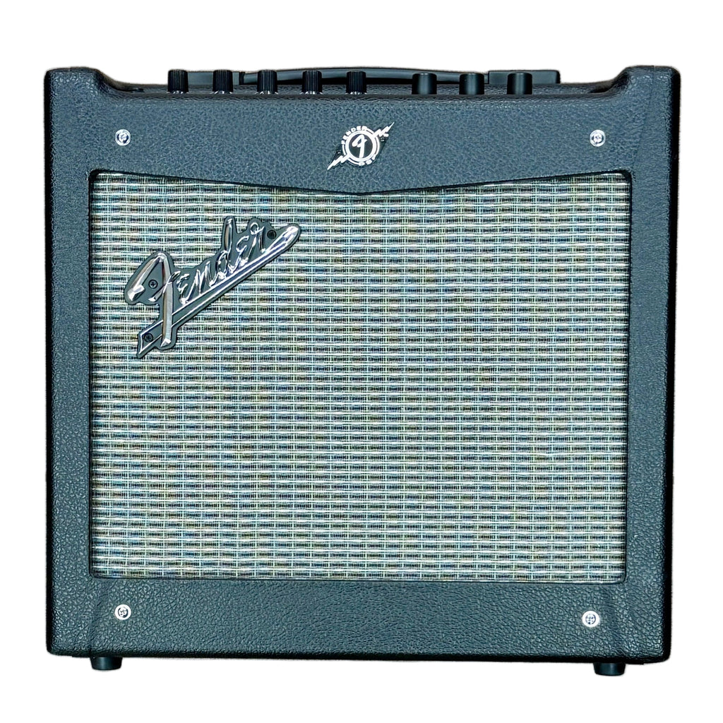 Fender MUSTANG I V2 Guitar Combo Amplifier Fender guitar amplifier on a wooden floor with a person's feet wearing socks.