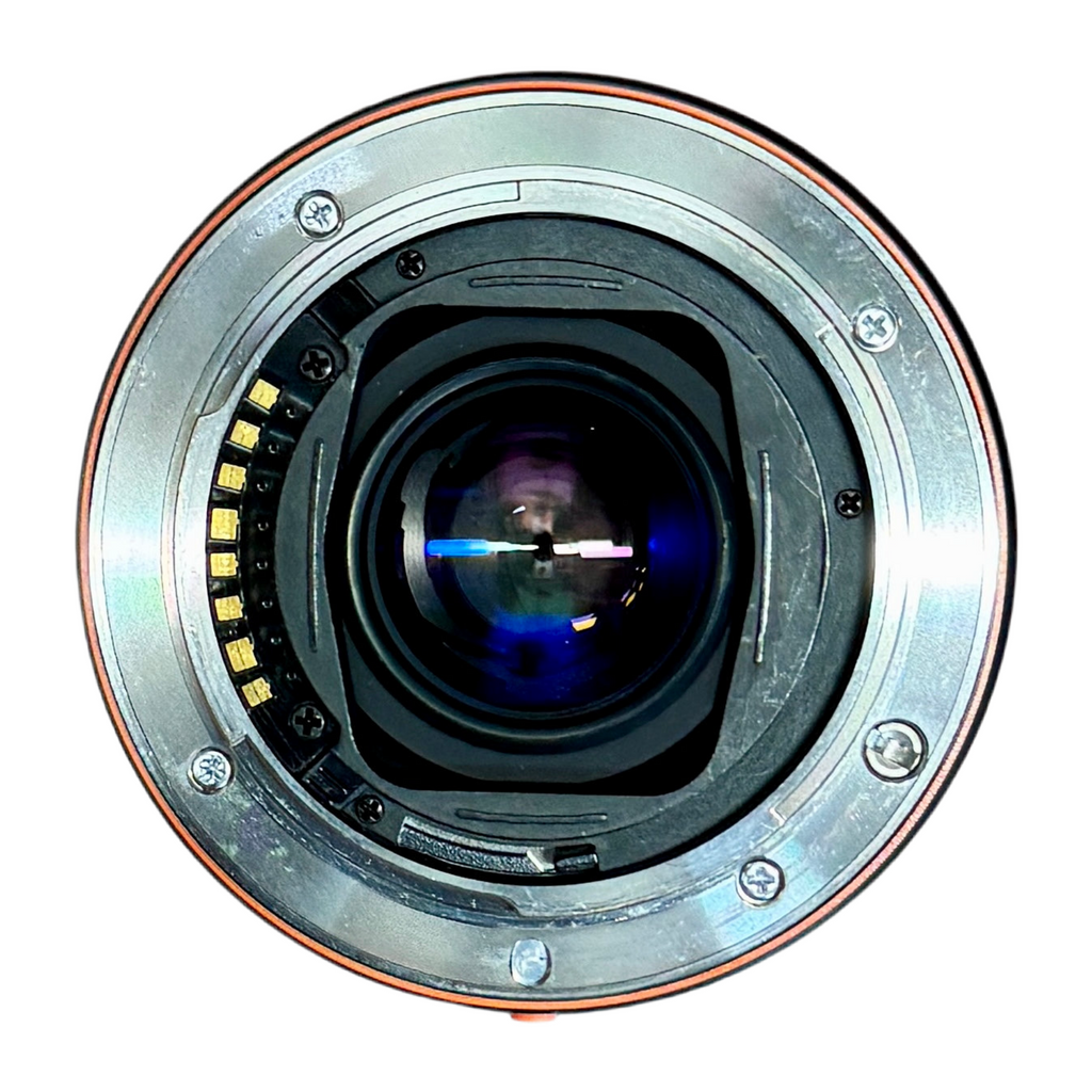 Sony SAL75300 75-300mm 4.5-5.6 1.5m/4.9ft Macro Camera Lens w/ Sony SH0007 Hood Close-up of a camera lens on a white background