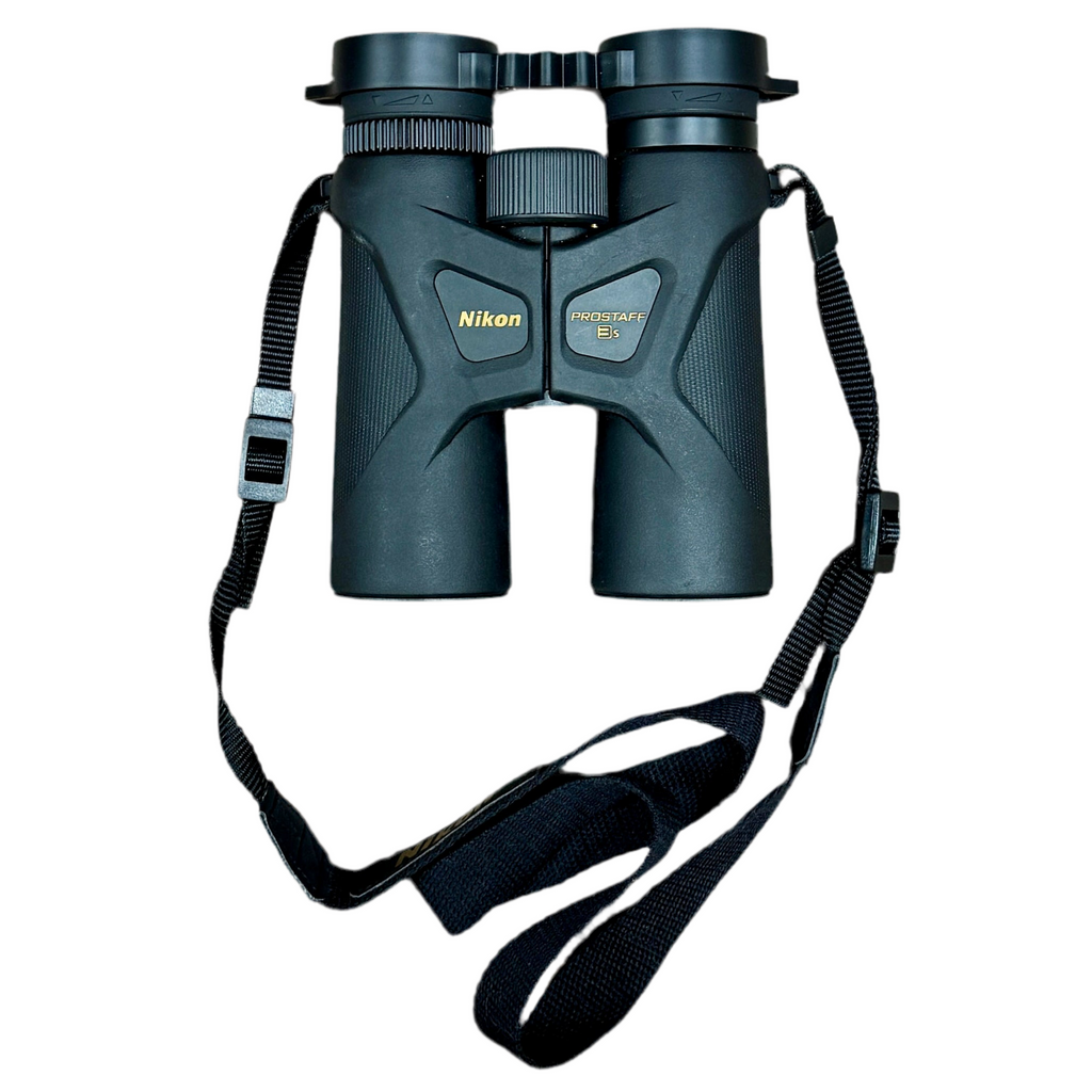 Nikon PROSTAFF 3S 10x42 7-Degree Waterproof Binoculars w/ Case & Caps Nikon binoculars with a strap on a white background