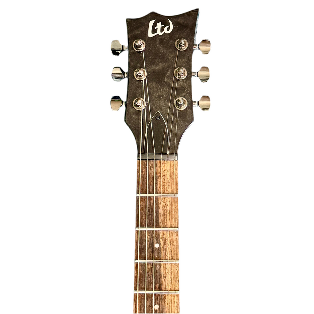 ESP LTD EC-100QM Electric Guitar headstock with 'Ltd' branding on a white background