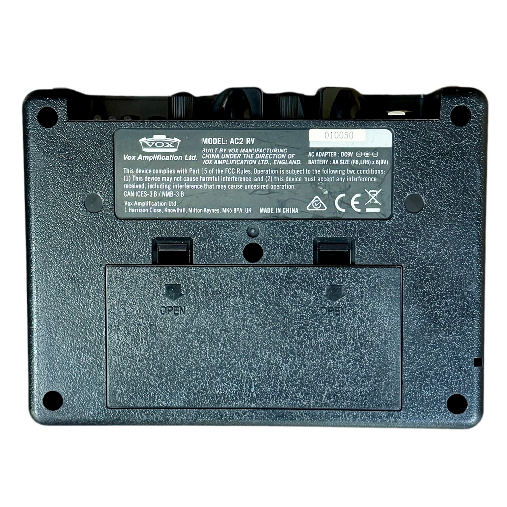 VOX AC2 RhythmVOX Mini Guitar Amplifier Back view of a VOX amplifier with branding and model information.