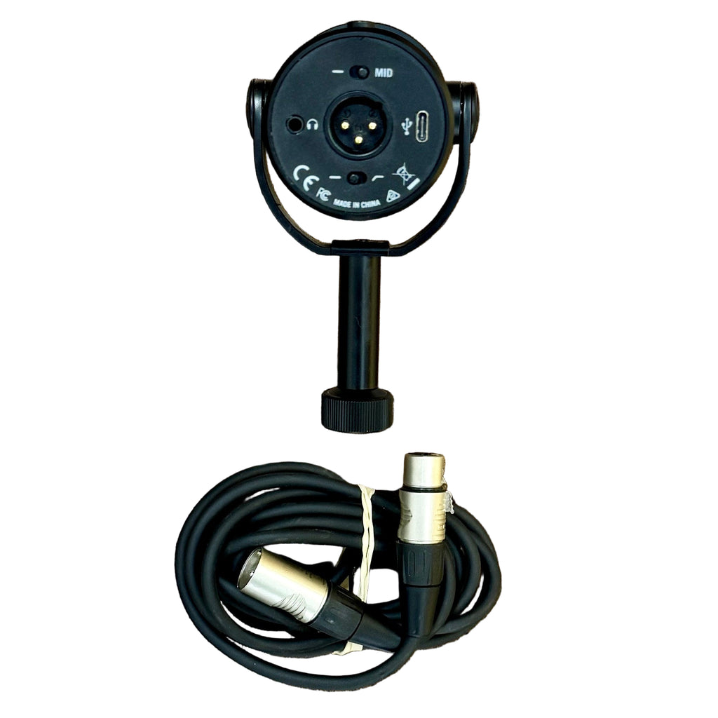 SAMSON Q9U Dynamic Broadcast Microphone w/ XLR Cable Black camera with a coiled cable on a wooden surface