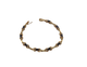 Gold bracelet with black stones on a white background