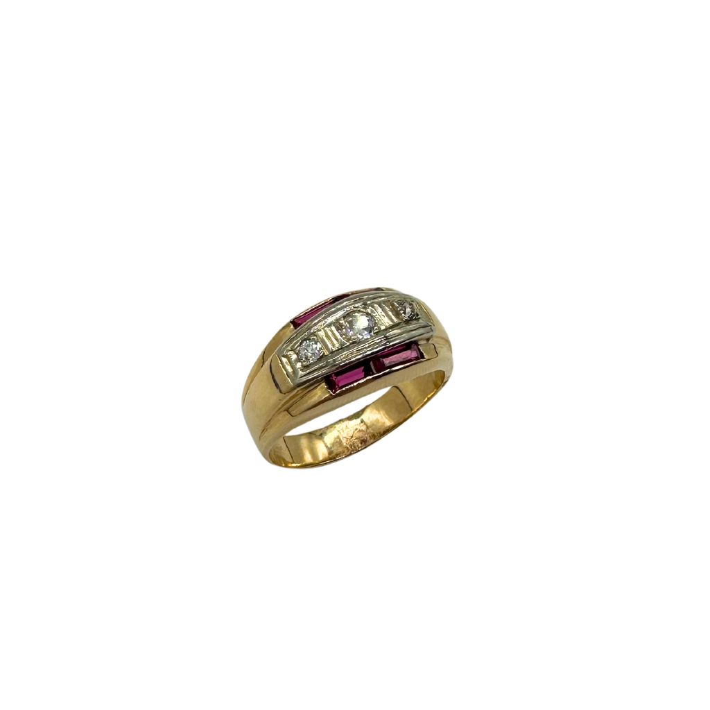 Gold ring with embedded gemstones on a white background