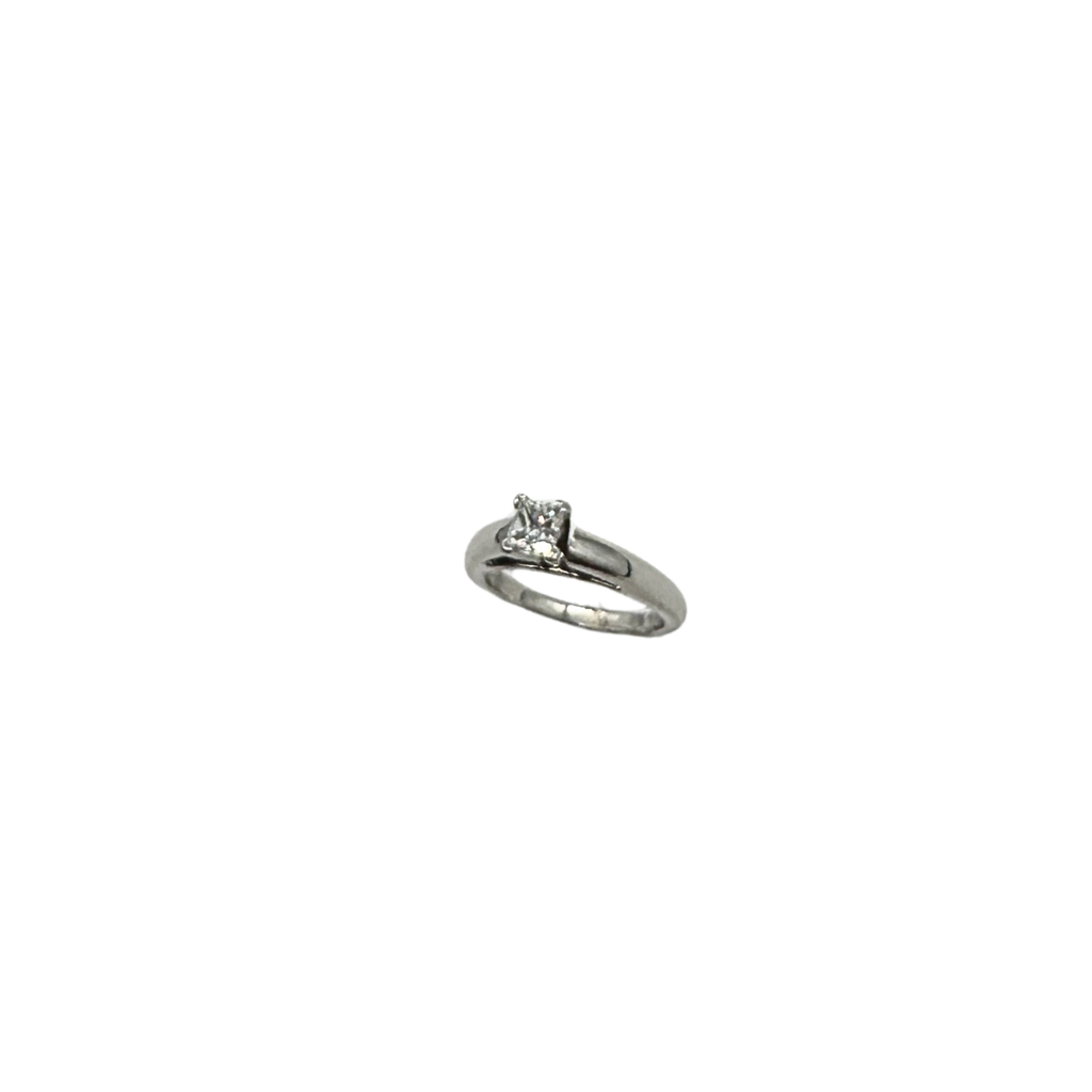 Silver ring with a diamond on a white background