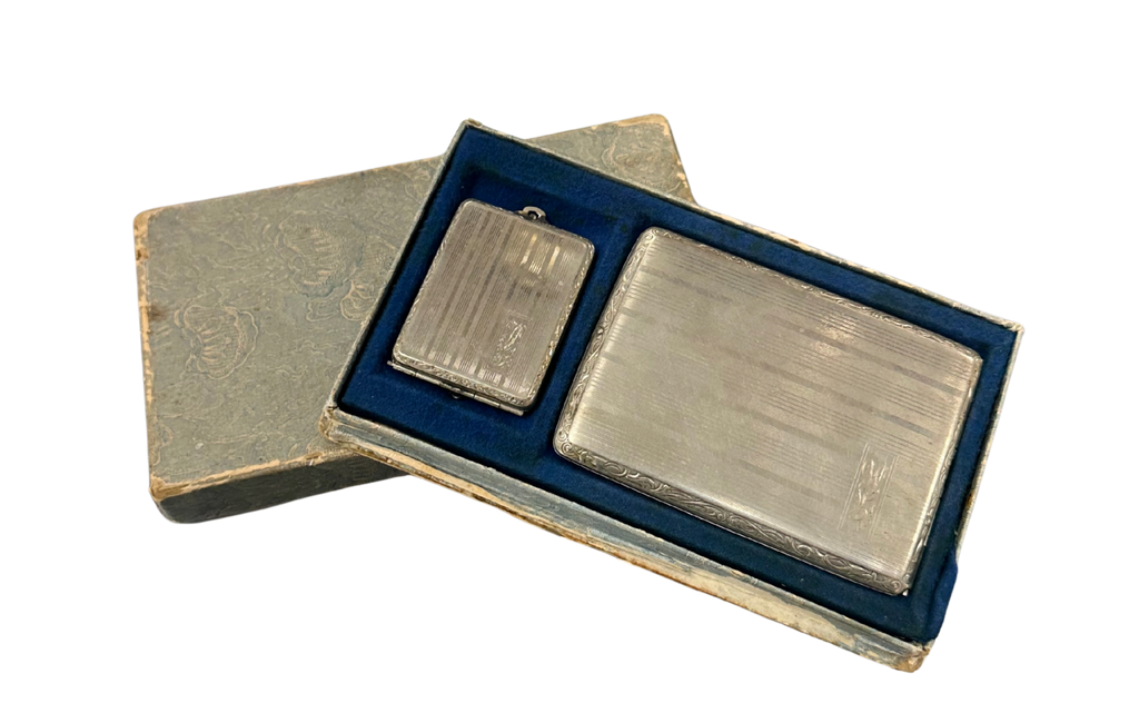 Two silver bars in a blue box on a white background
