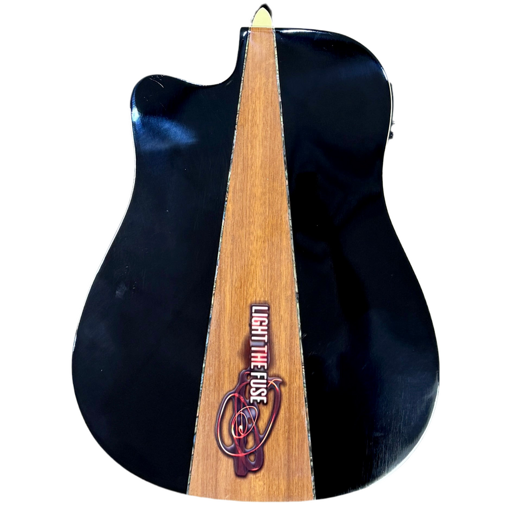 Keith Urban Limited Edition Light The Fuse Acoustic-Electric Guitar w/ Hard Case (6,008/21,000) Black electric guitar with a wooden neck featuring 'Light the Fuse' branding on a white background