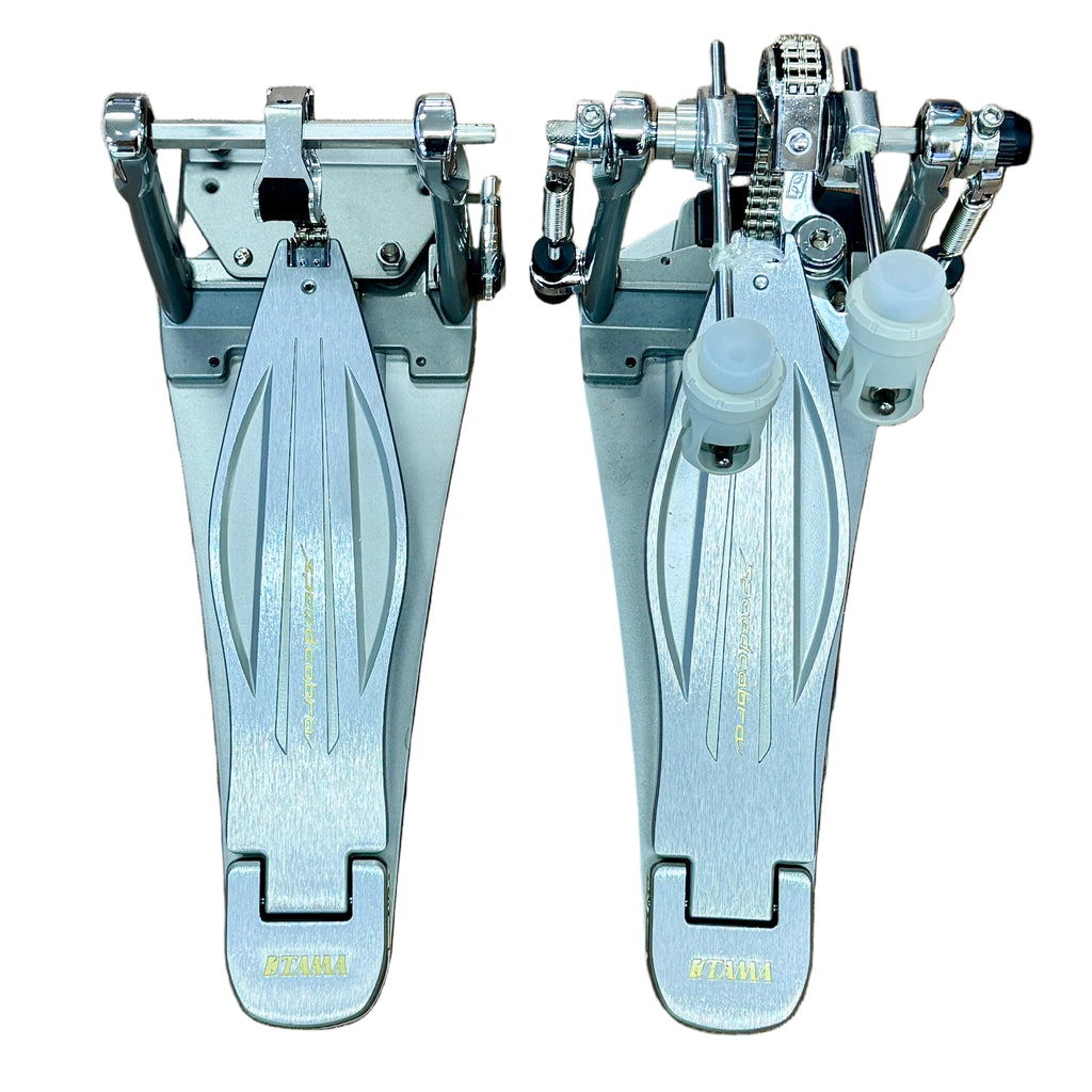 TAMA Speed Cobra 910 Twin Double Bass Drum Pedal w/ Hard Case Pair of drum pedals on a white background