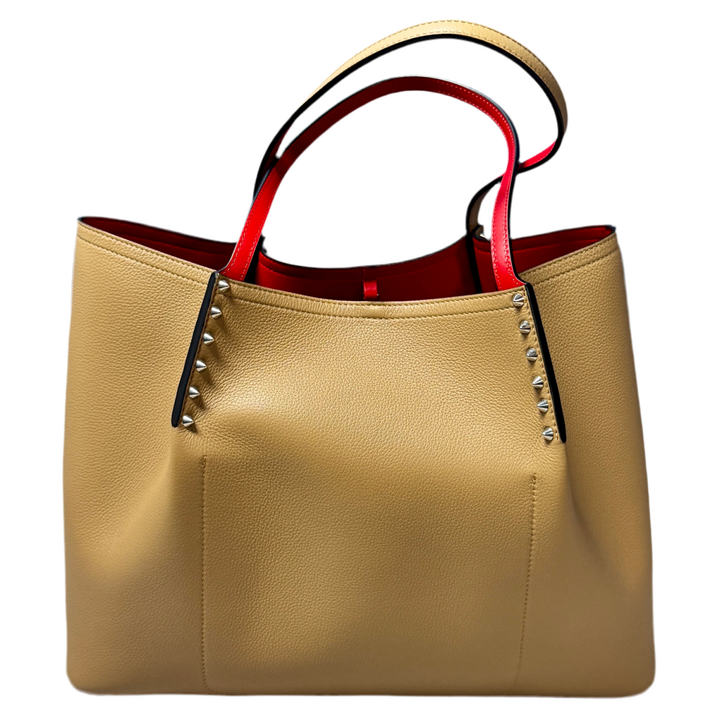 Christian Louboutin Cabarock Large Calfskin Leather Tote Bag - Fennec Beige handbag with red interior and studded details on a white background