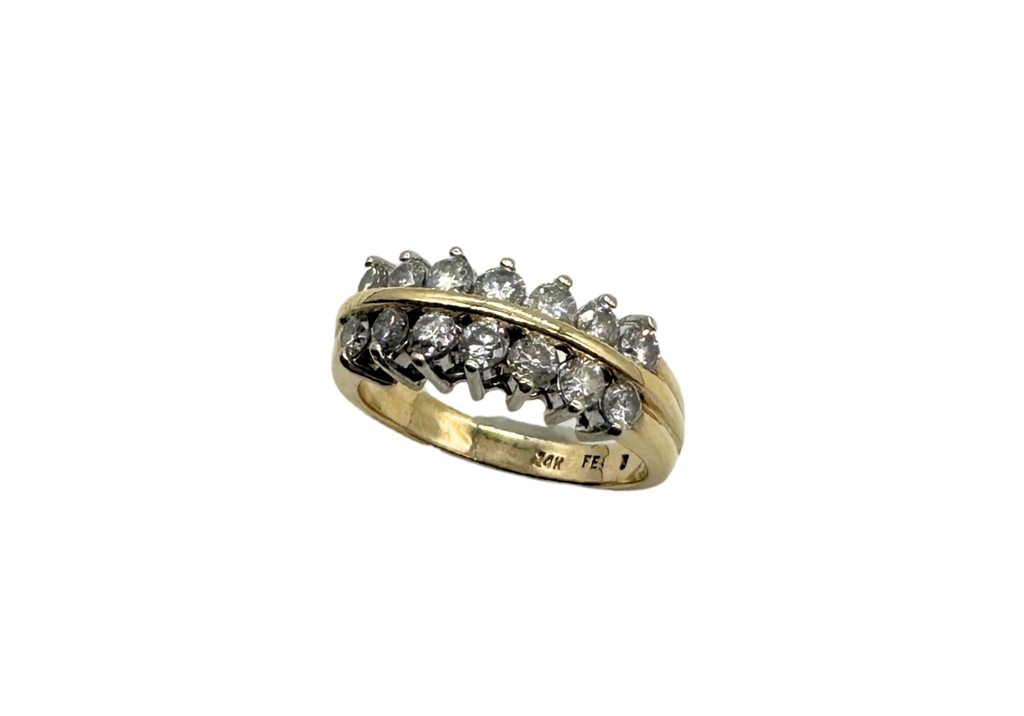 Gold ring with diamonds on a white background