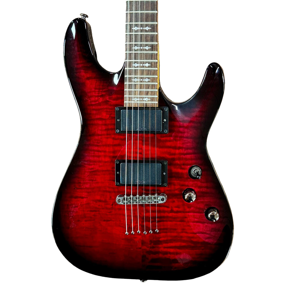 Schecter Diamond Series DEMON-6 Electric Guitar Red electric guitar on a wooden floor