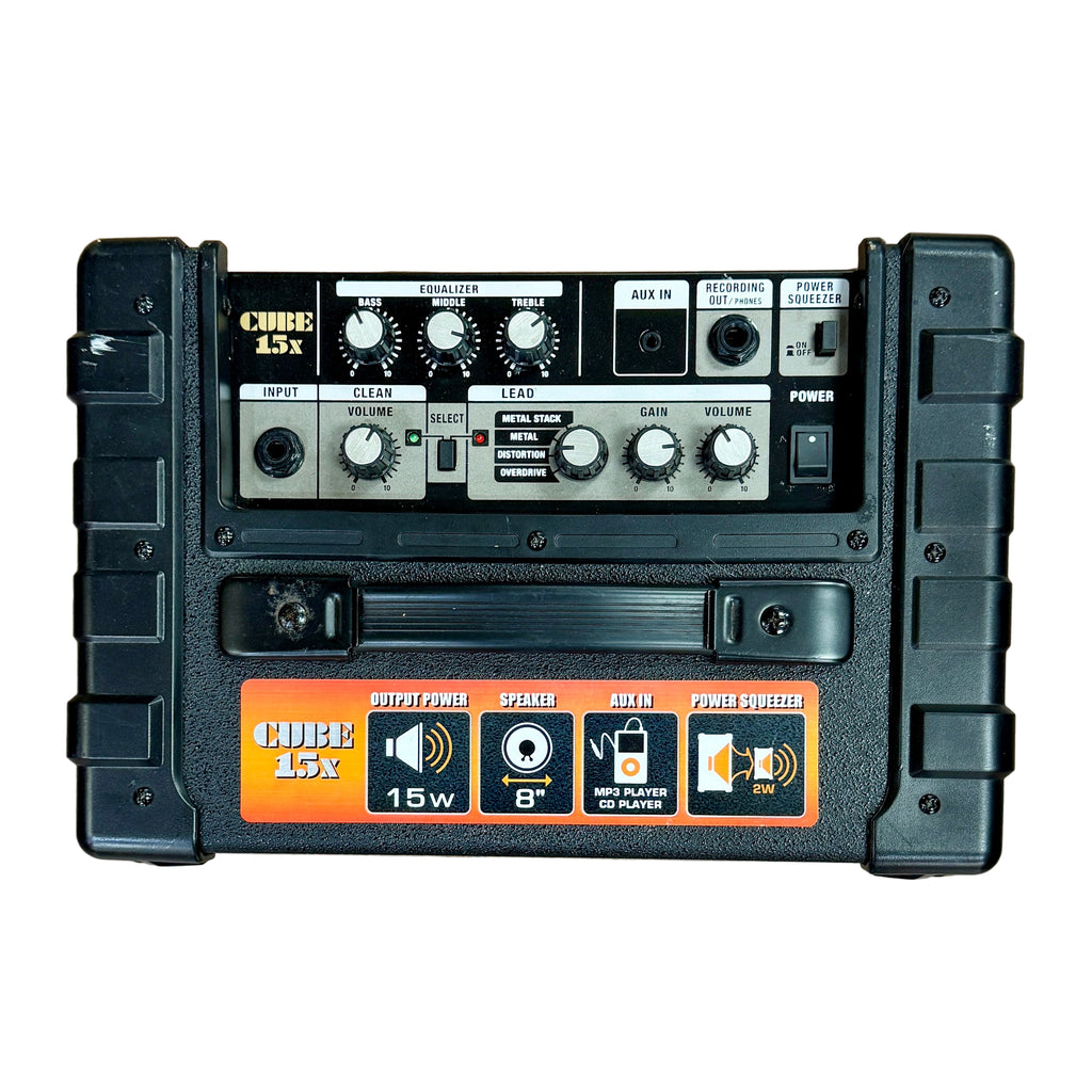 Roland CUBE-15X Guitar Combo Amplifier Guitar effects pedal on a wooden surface