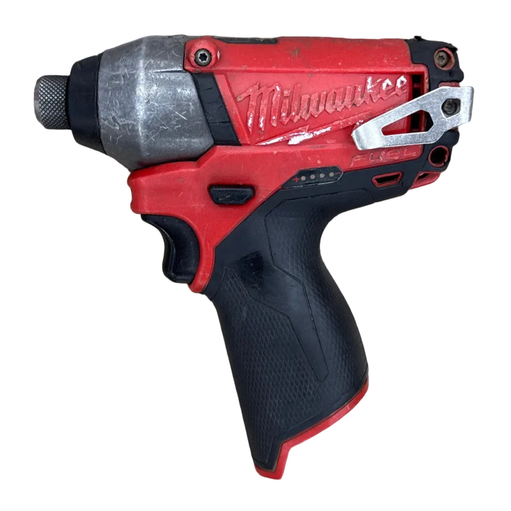 Milwaukee M12 FUEL 12V 1/4" Brushless Cordless Hex Impact Driver w/ Battery (2453-20) Red and black Milwaukee power drill on a wooden surface