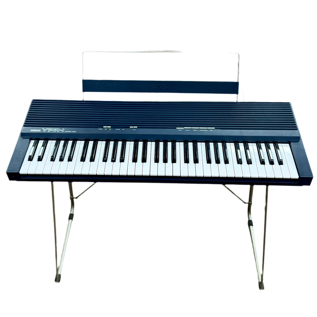 Yamaha YPR-1 Portable Digital Piano Musical Keyboard Black keyboard with stand on a white background