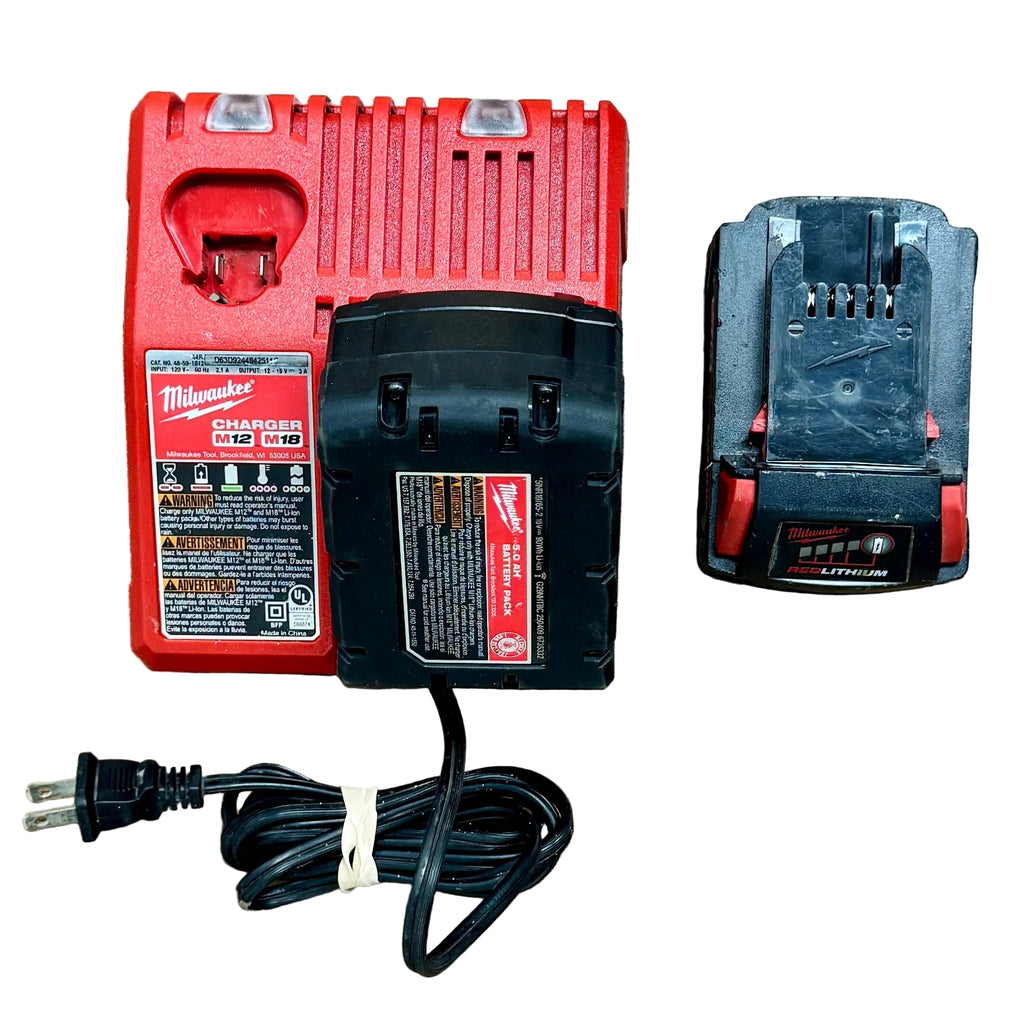 Milwaukee M18 FUEL 18V 6-1/2" Brushless Cordless Circular Saw w/ 2 Batteries & Charger (2833-20) Red Milwaukee charger and black battery on a wooden surface