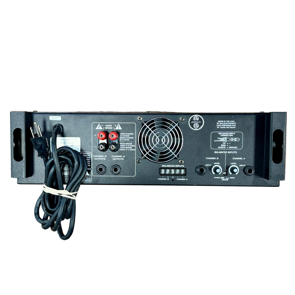 Audio Centron EQUINOX MP-1200 Power Amplifier Audio amplifier with cables on a wooden floor, with shoes at the bottom of the frame.