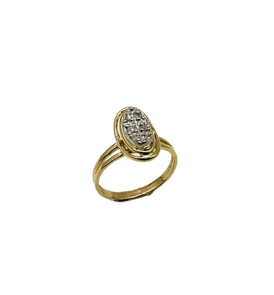 Gold ring with a diamond cluster on a white background