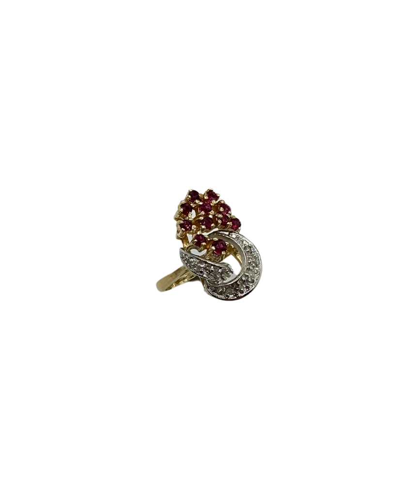Gold ring with gemstones on a white background