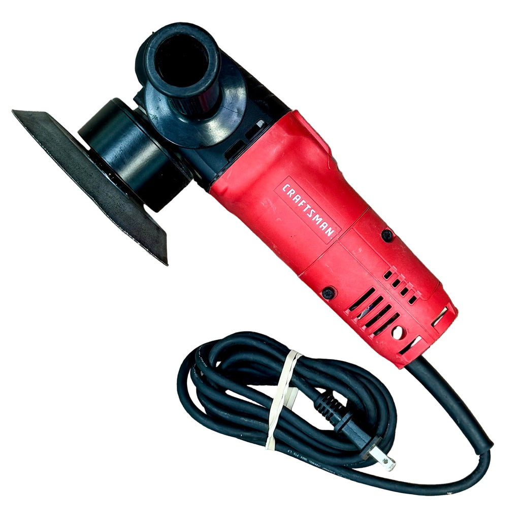 CRAFTSMAN 4.5-Amp 6" Corded Electric Variable-Speed Random Orbit Polisher (CMEE145) Red Craftsman power tool with black cord on a wooden floor