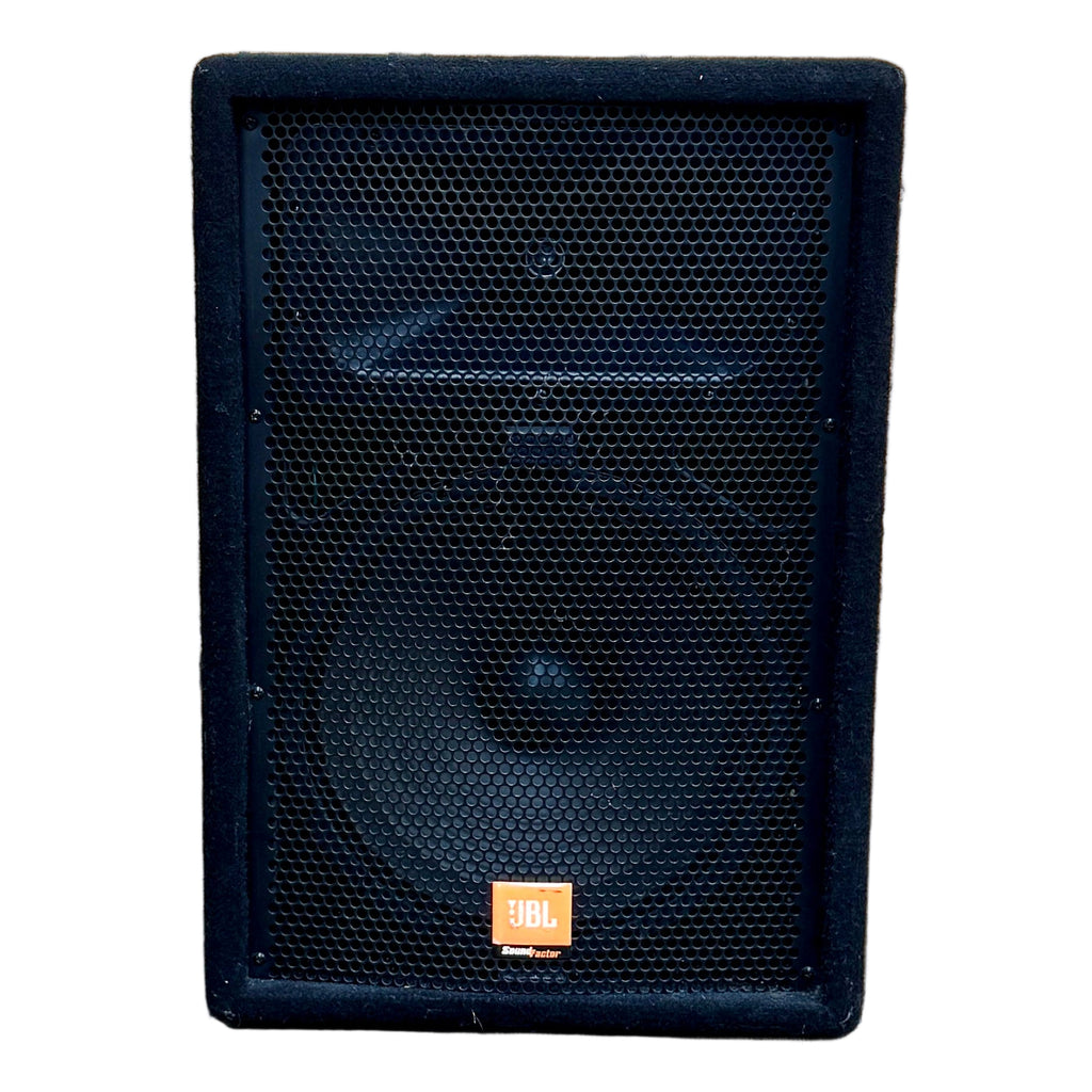 JBL Sound Factor SF12M 12" Two-Way Stage Monitor Speaker Black speaker on a wooden floor with a wooden wall in the background