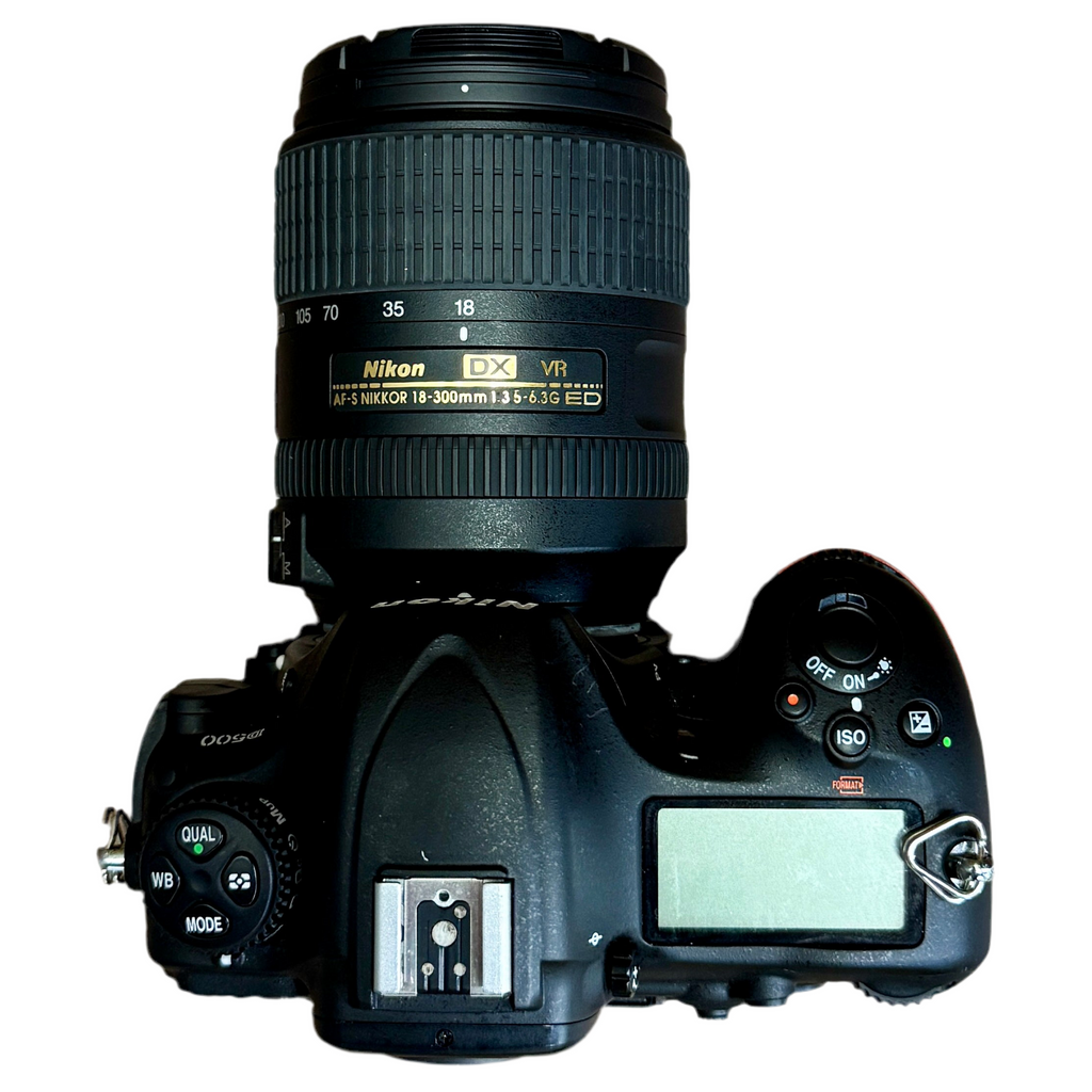 Nikon D500 DX-Format Digital SLR Camera w/ Nikon AF-S DX NIKKOR 18-300mm f/3.5-6.3G ED VR Lens Nikon DSLR camera with lens on a white background