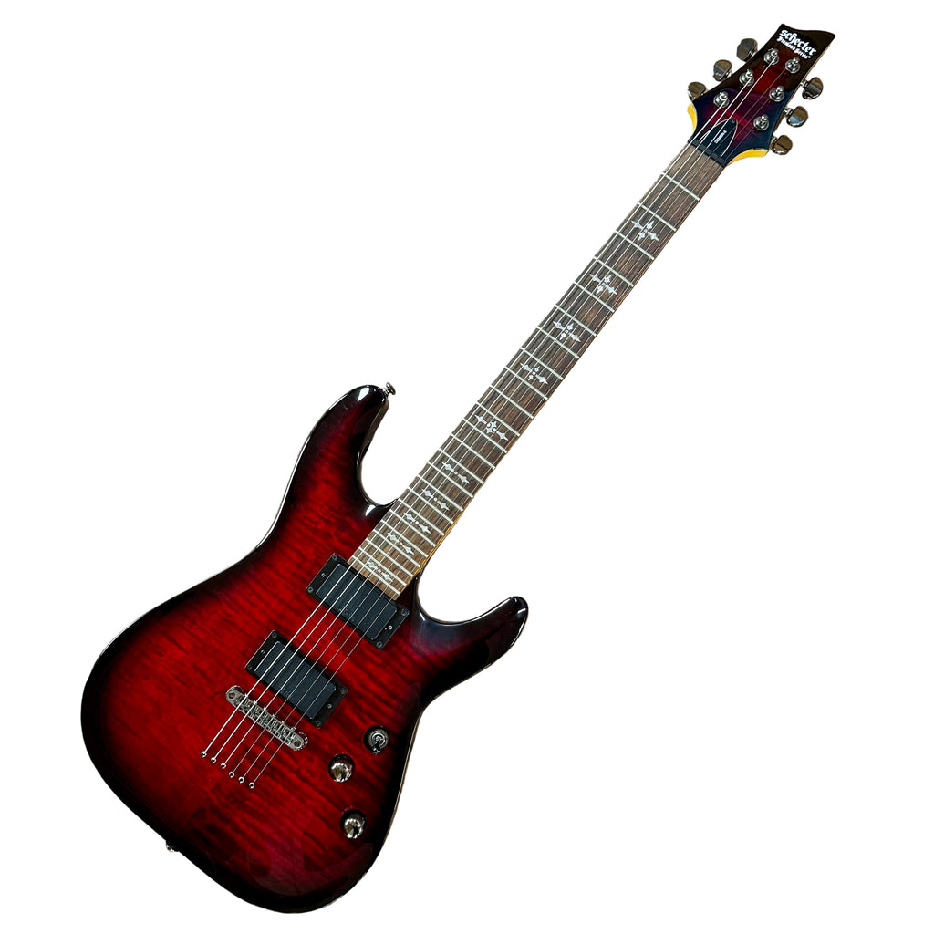 Schecter Diamond Series DEMON-6 Electric Guitar Electric guitar with a red and black finish on a white background