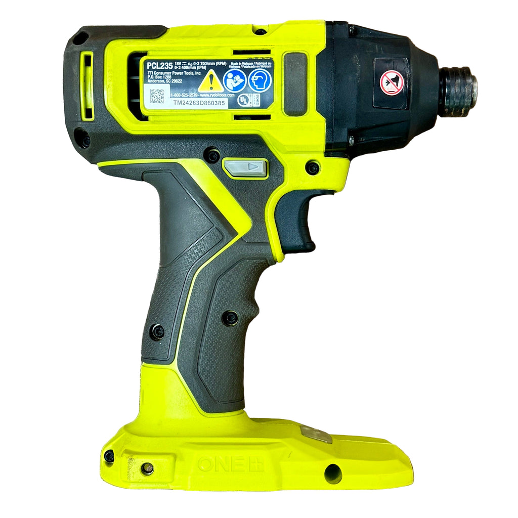 RYOBI ONE+ 18V 1/4" Cordless Impact Driver w/ Battery (PCL235) Yellow and black cordless drill on a wooden surface