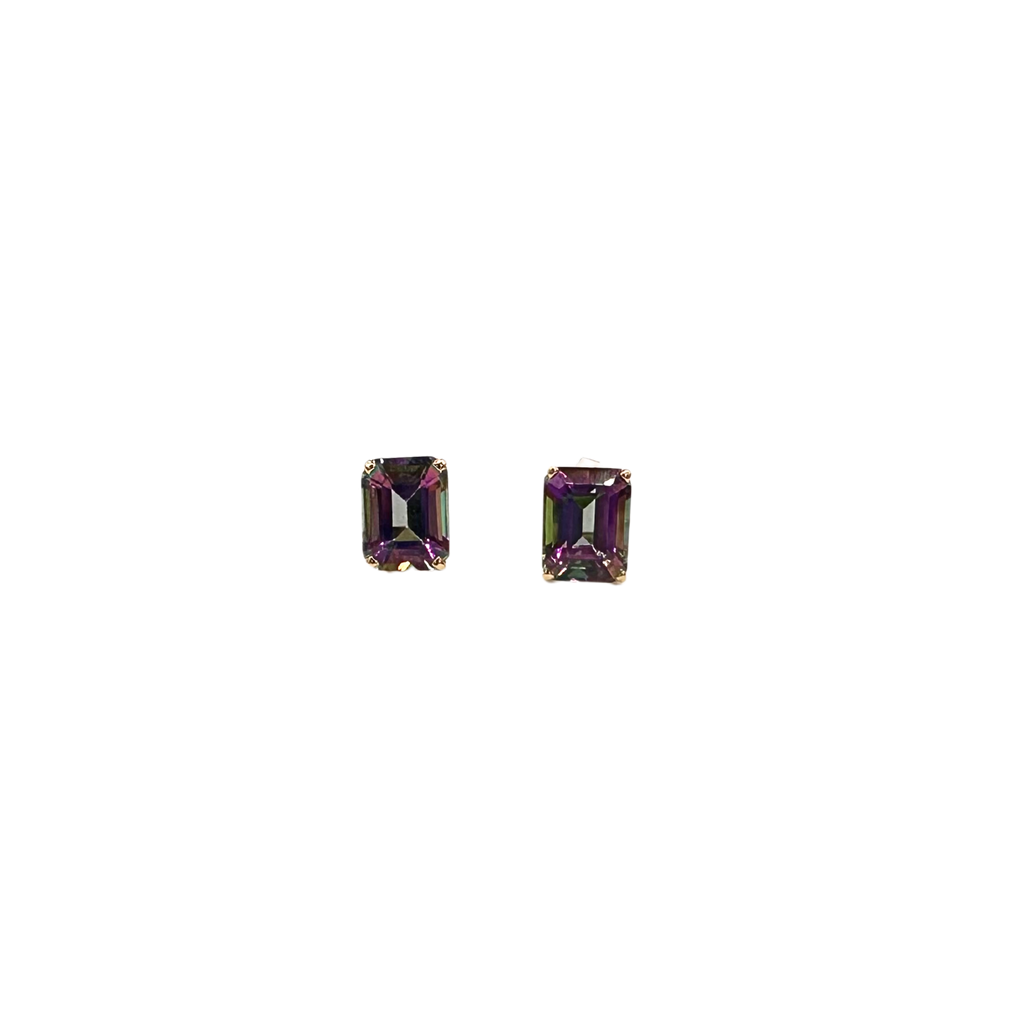 Pair of emerald-cut gemstone earrings on a white background
