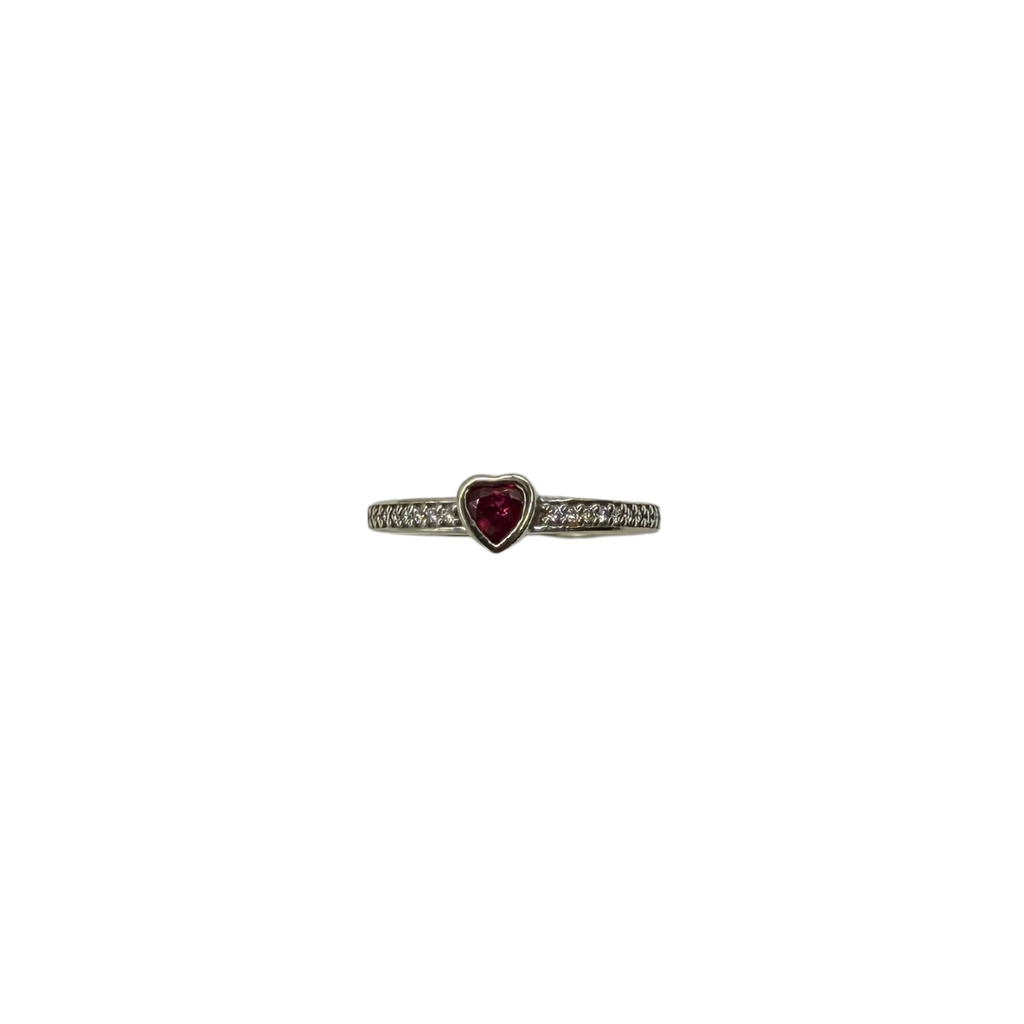 Ring with a heart-shaped gemstone on a white background