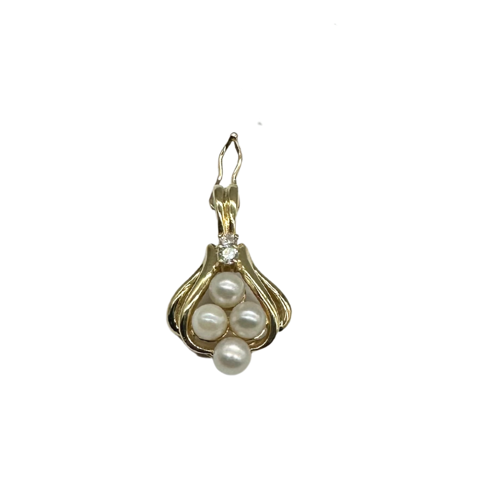 Gold pendant with pearls on a white background