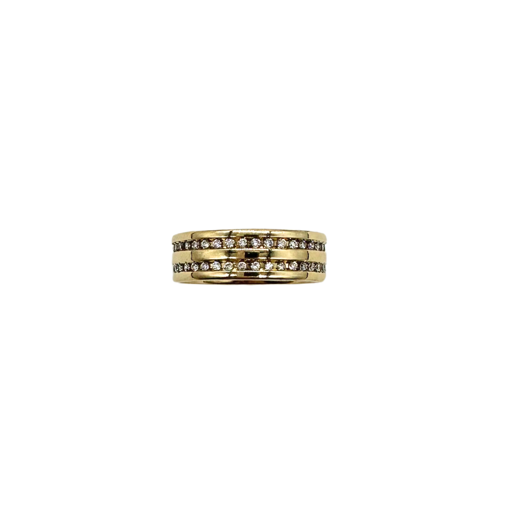 Gold ring with embedded diamonds on a white background