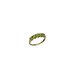 Gold ring with green gemstones on a white background