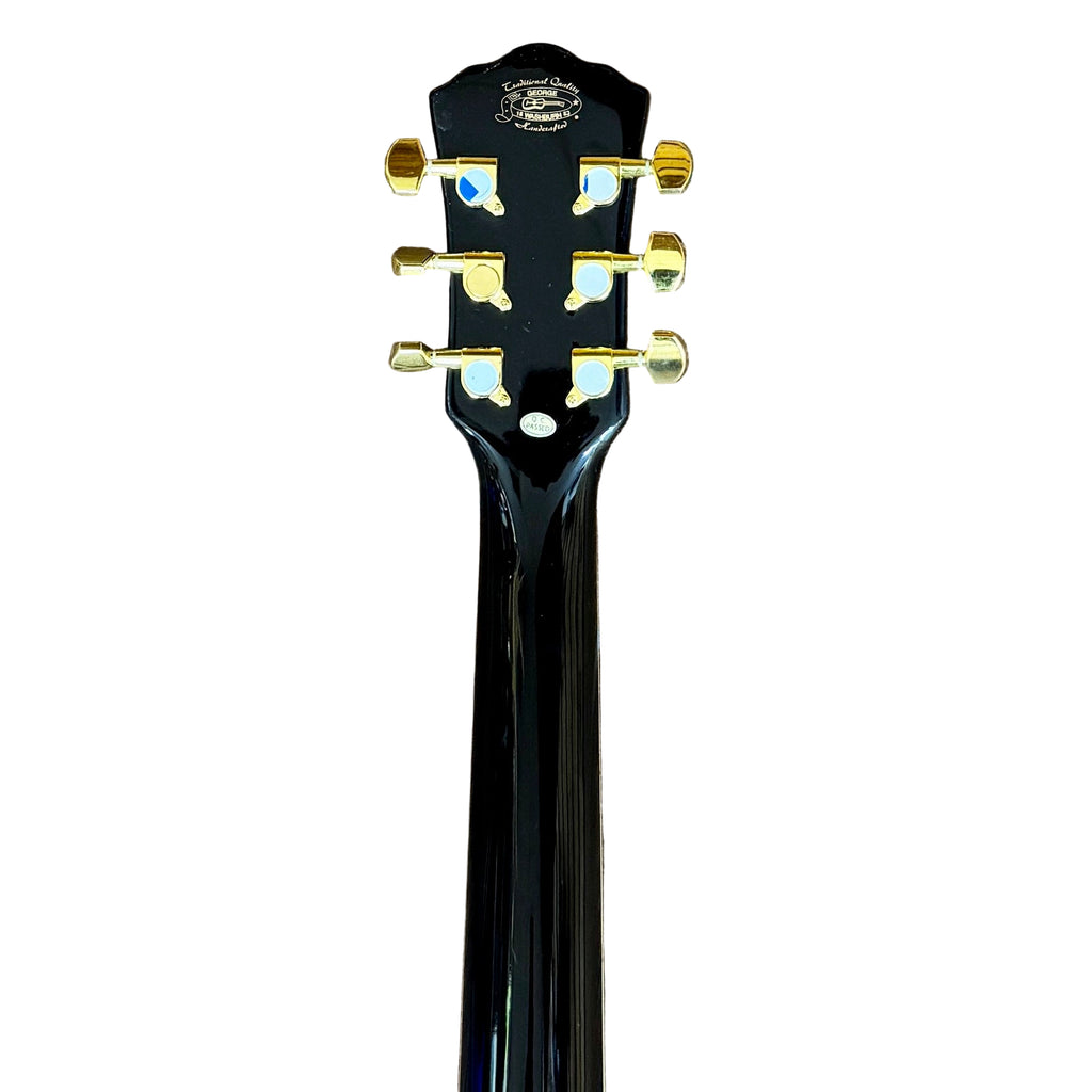 Washburn Festival Series EA55G-A-U Acoustic-Electric Guitar Close-up of a black guitar headstock with gold tuning pegs on a white background